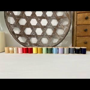 Vintage wooden spools with thread